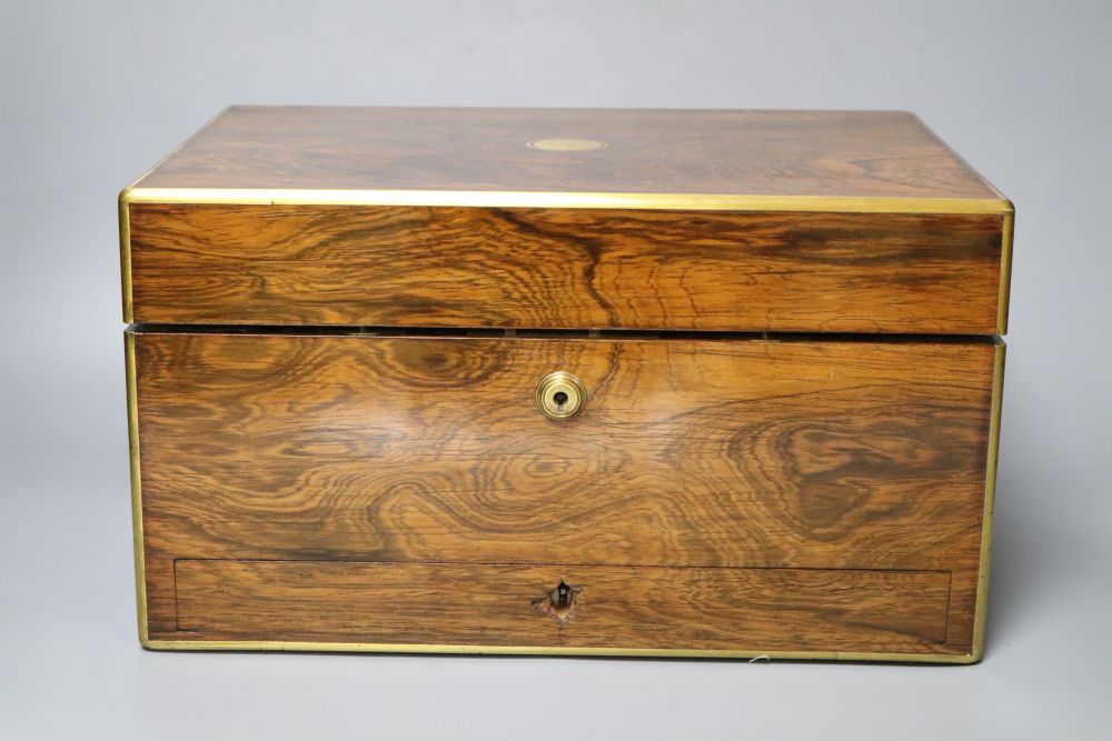 A Regency brass mounted rosewood toilet box, with glass contents and base drawer, width 36cm